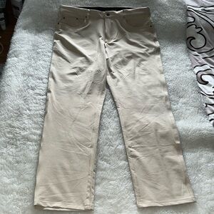 Greg Norman lightweight golf pants in neutral sandstone color, size 36x30